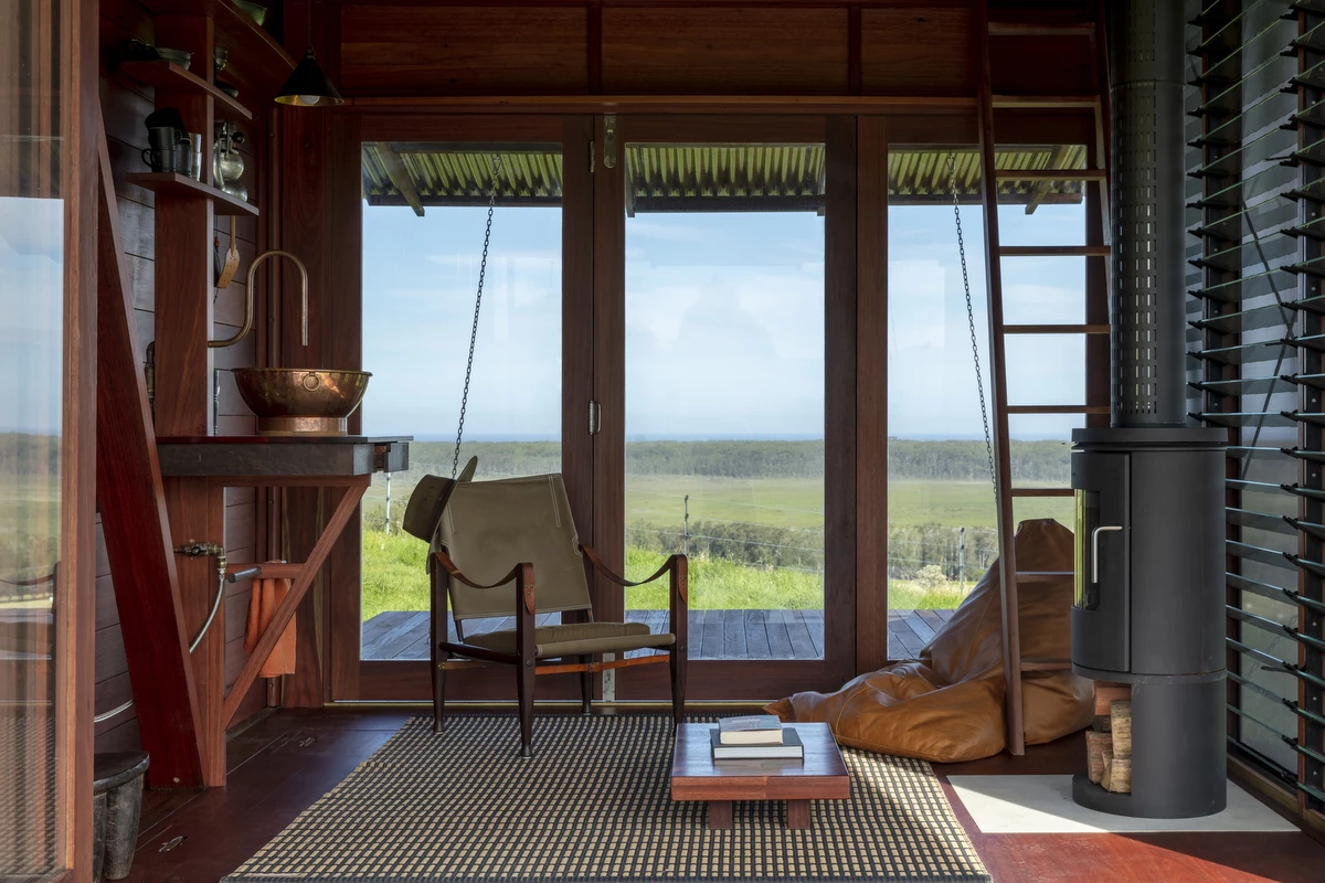 The cabin features a basic open-space interior inspired from boat building