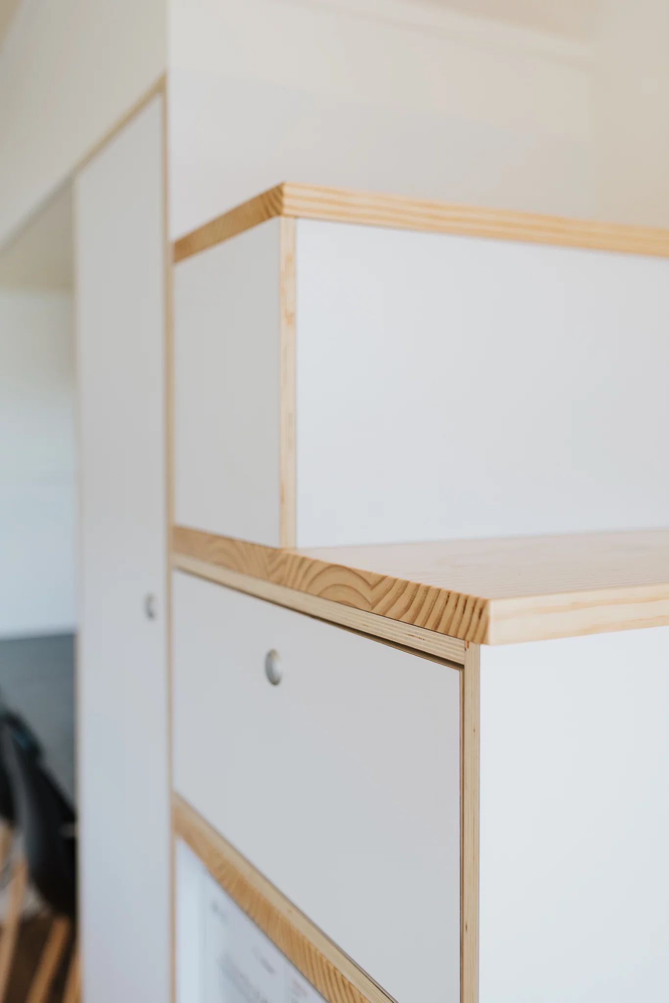 The Bitser Tiny House includes a storage-integrated staircase