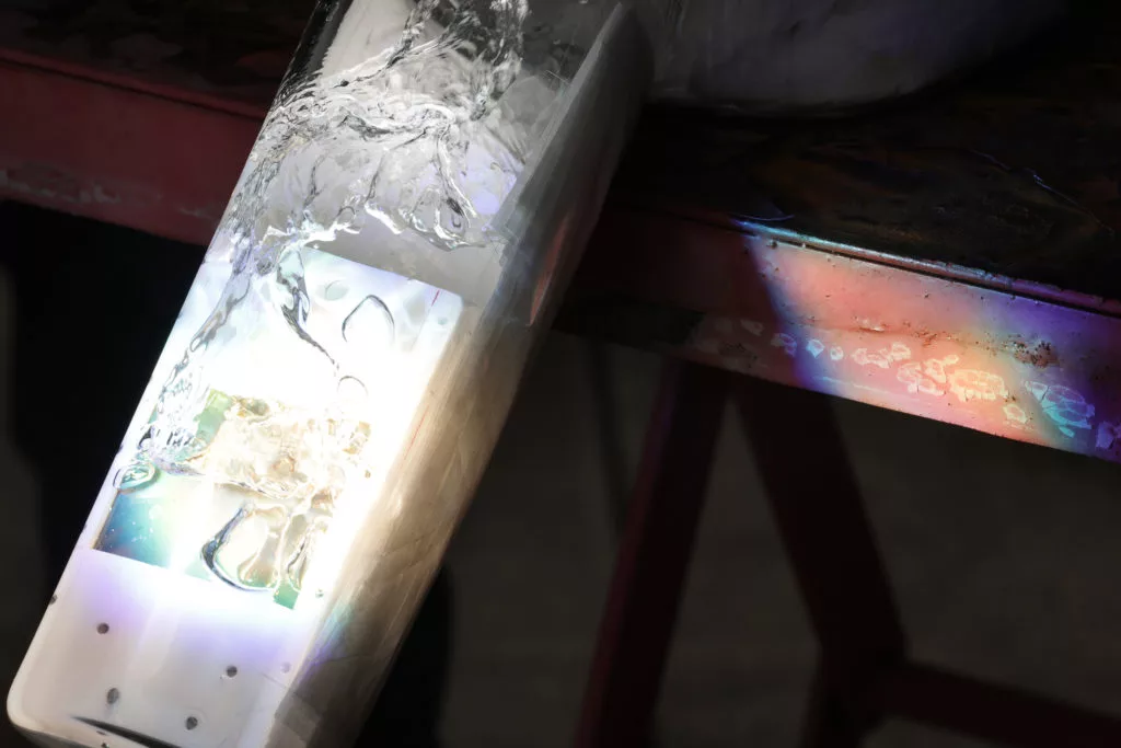 Water runs over the artificial photosynthesis cell, warmed by infrared radiation to supercharge the device's performance