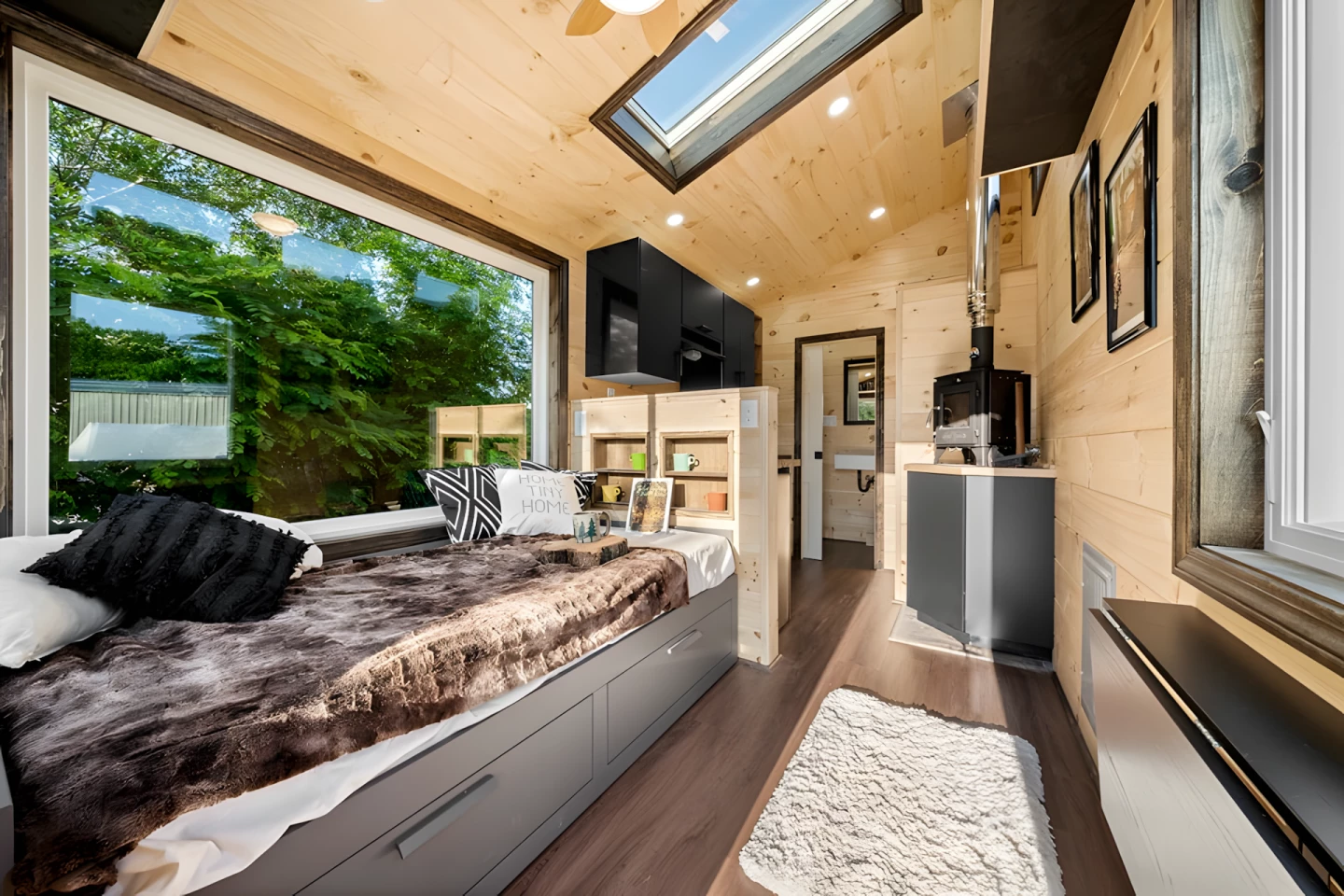 The Little Lodge's living room includes a daybed with integrated storage space