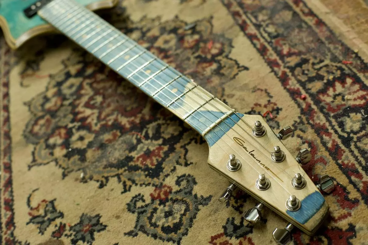 The neck is made from layered maple, with Galasso branding on the head