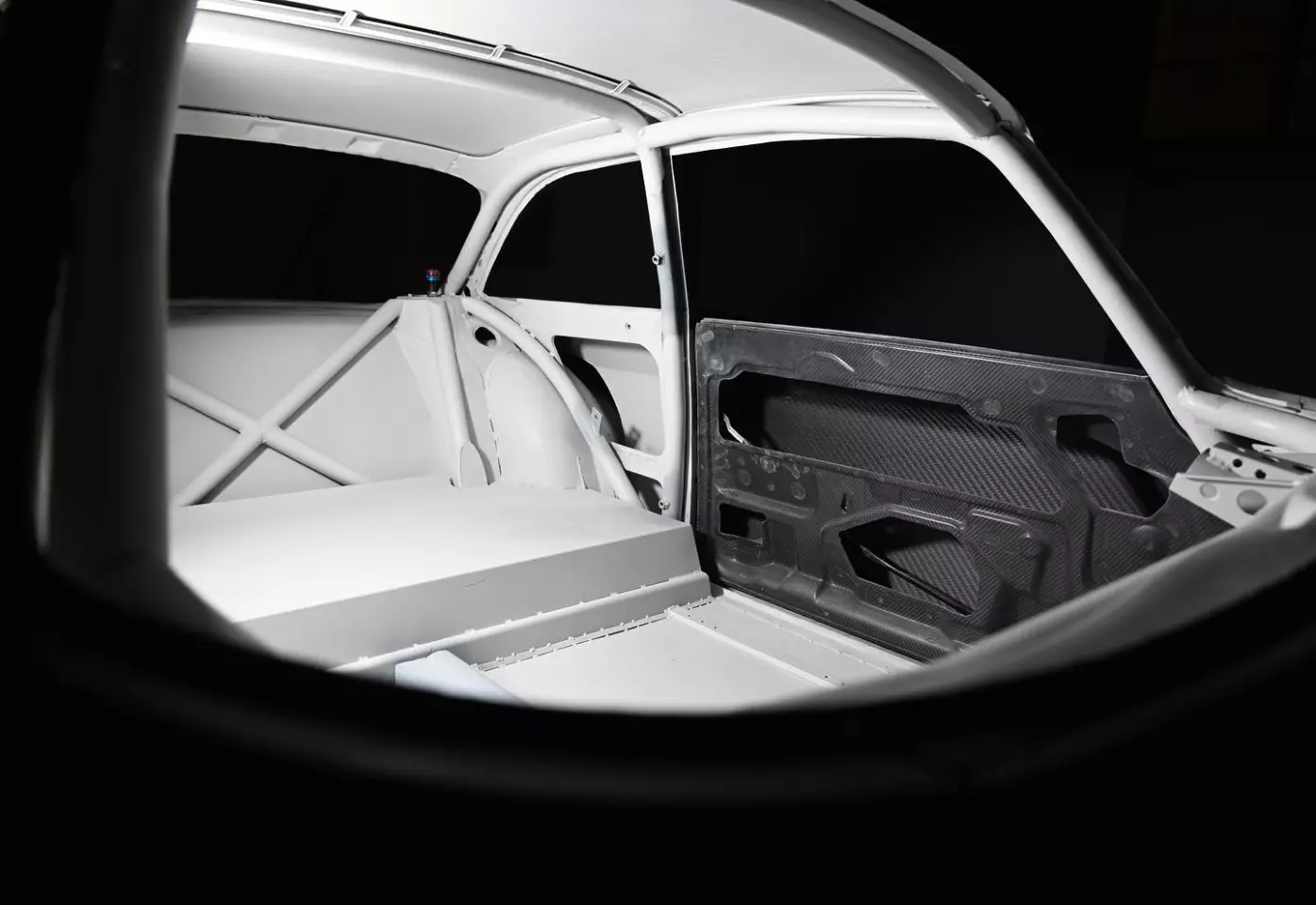 The roll cage follows the original contours of the car to add strength without changing the classic look