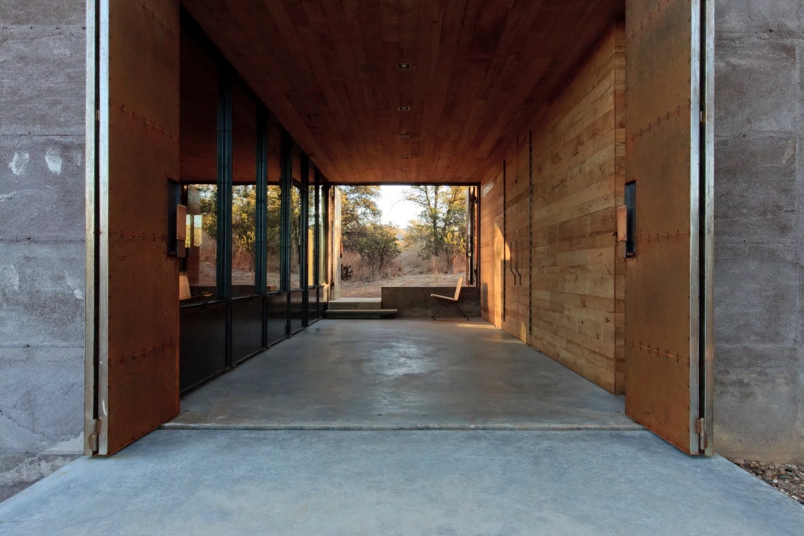 The recently-completed home is definitely a case of function over form and looks like a bunker of some kind at first glance