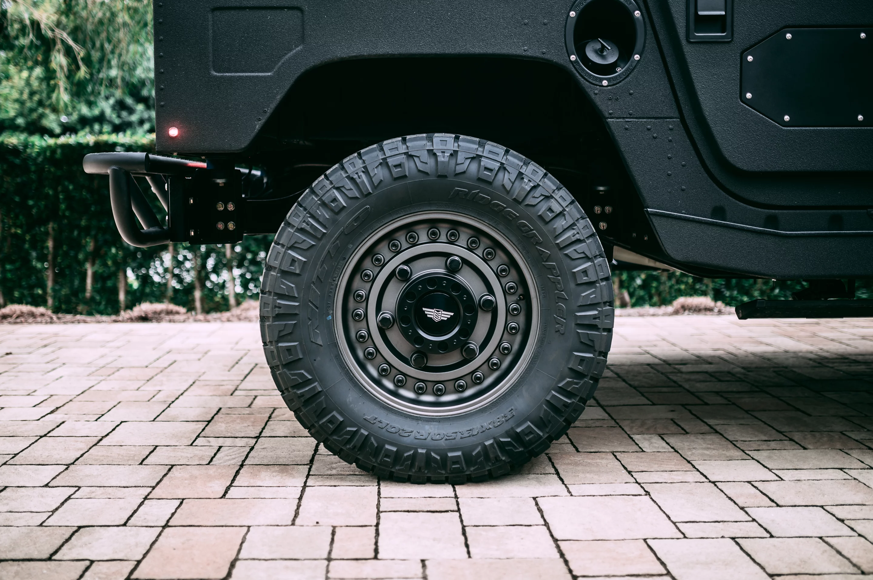 38x13.50R20 Nitto Ridge Grappler tires on 20x9.5 Black Rhino Armory beadlock wheels give it that M*A*S*H look