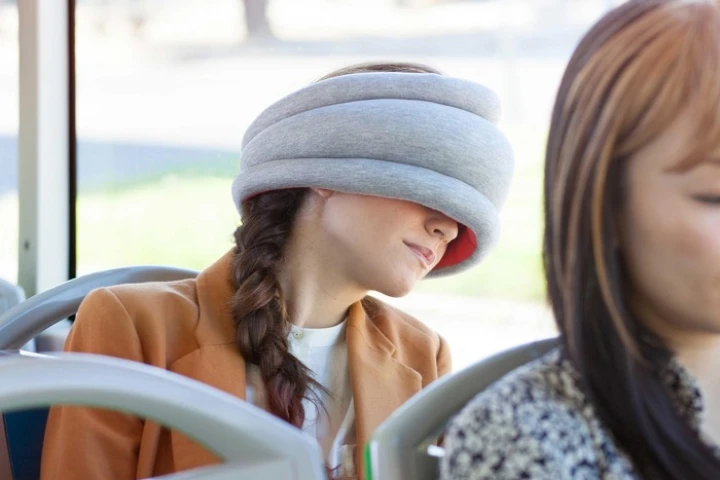 The Ostrich Pillow Light can be used by commuters seeking to grab 40 winks on the bus