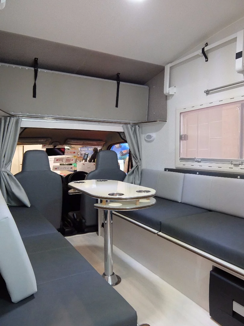 The interior of the neo-EURO has a central mounted table with seating either side