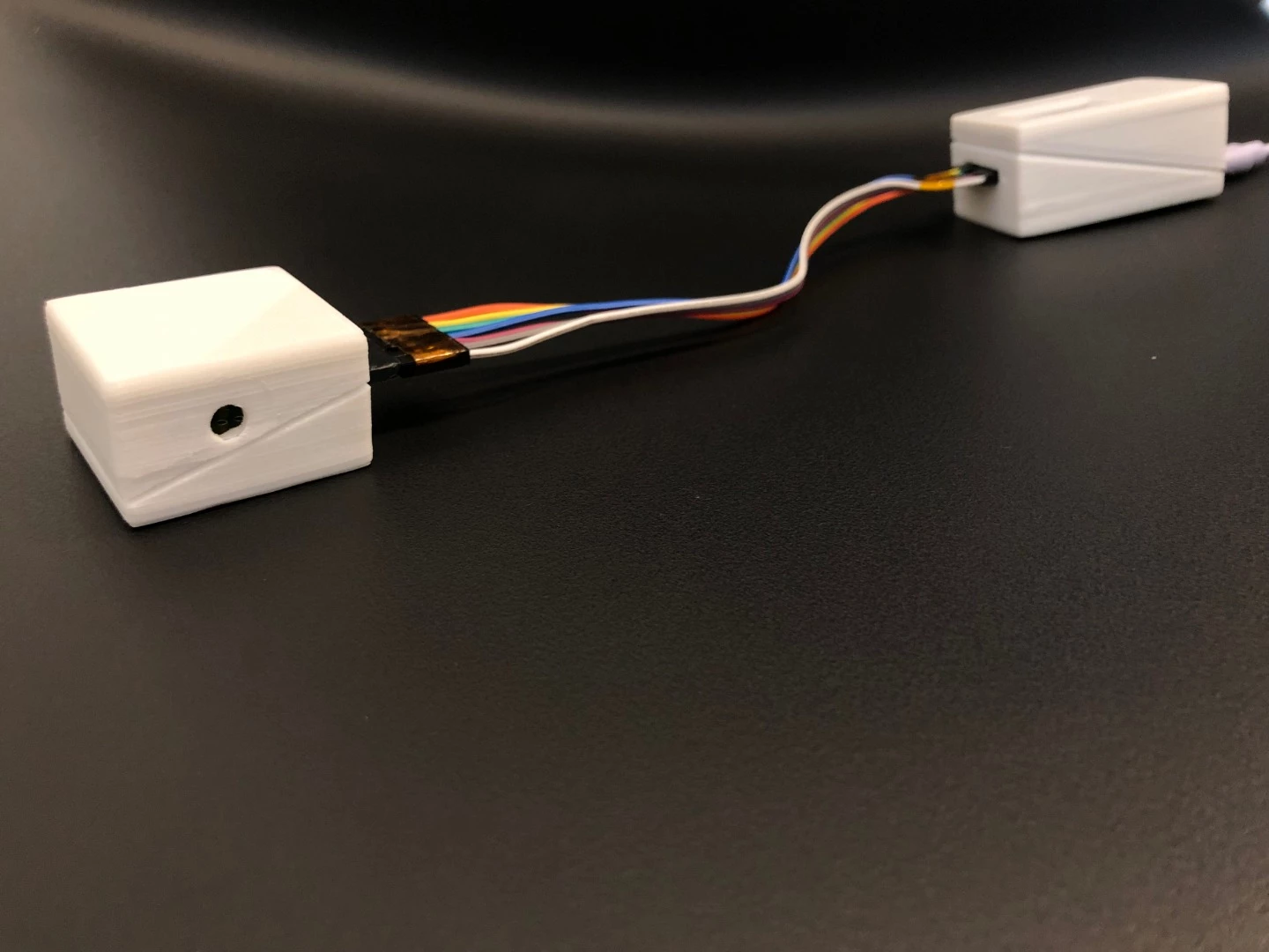 The prototype consists of a sensor connected to a box which both shows the emissions levels in real time, and saves the results