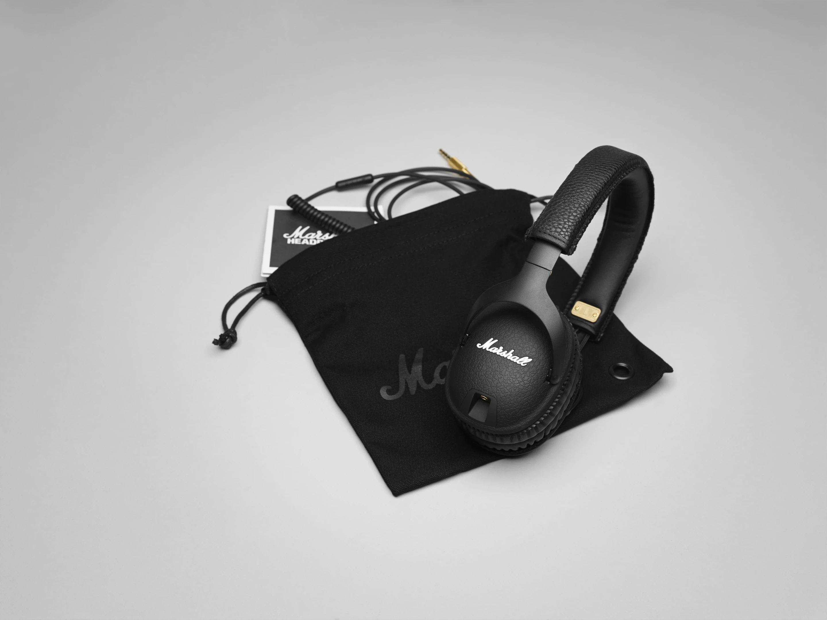 The Marshall Monitor over-ear headphones come supplied with a canvas carry pouch embossed with a script Marshall logo