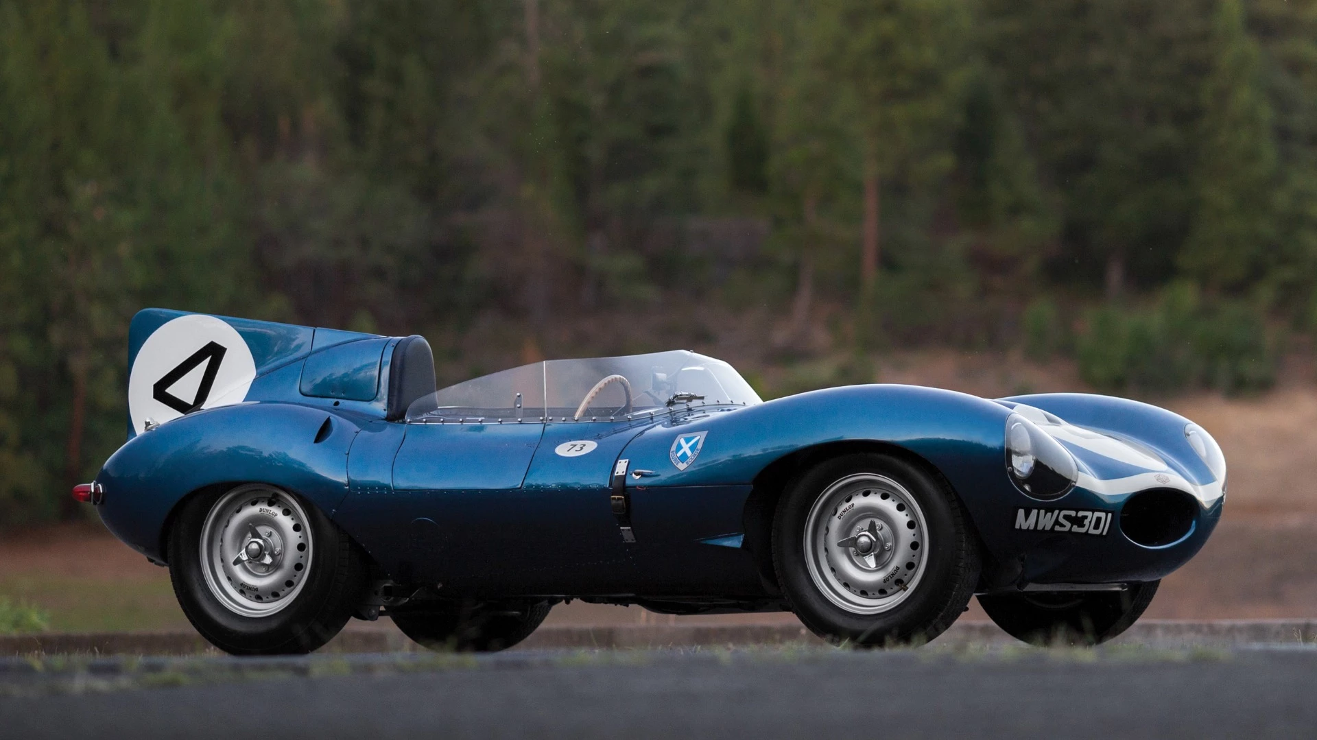 This 1955 Jaguar D-Type (chassis no. XKD 501) was the first D-Type supplied by Jaguar to a non-factory team, the famous Scottish Racing team, Ecurie Ecosse, which used it to win the 1956 24 Hours of Le Mans with drivers Ron Flockhart and Ninian Sanderson. The car spent the previous two decades in one of America's leading automotive collections prior to its sale by RM-Sothebys at Monterey, 2016 where it sold for $21,780,000 to become the most valuable British car ever to sell at auction.
