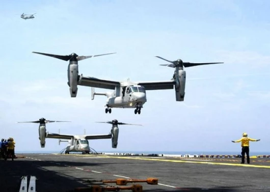 V-22s land on an aircraft carrier during trials