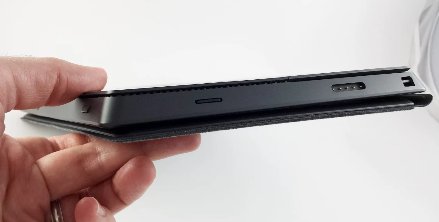 The Surface Pro is 13.5 mm thick, without the cover