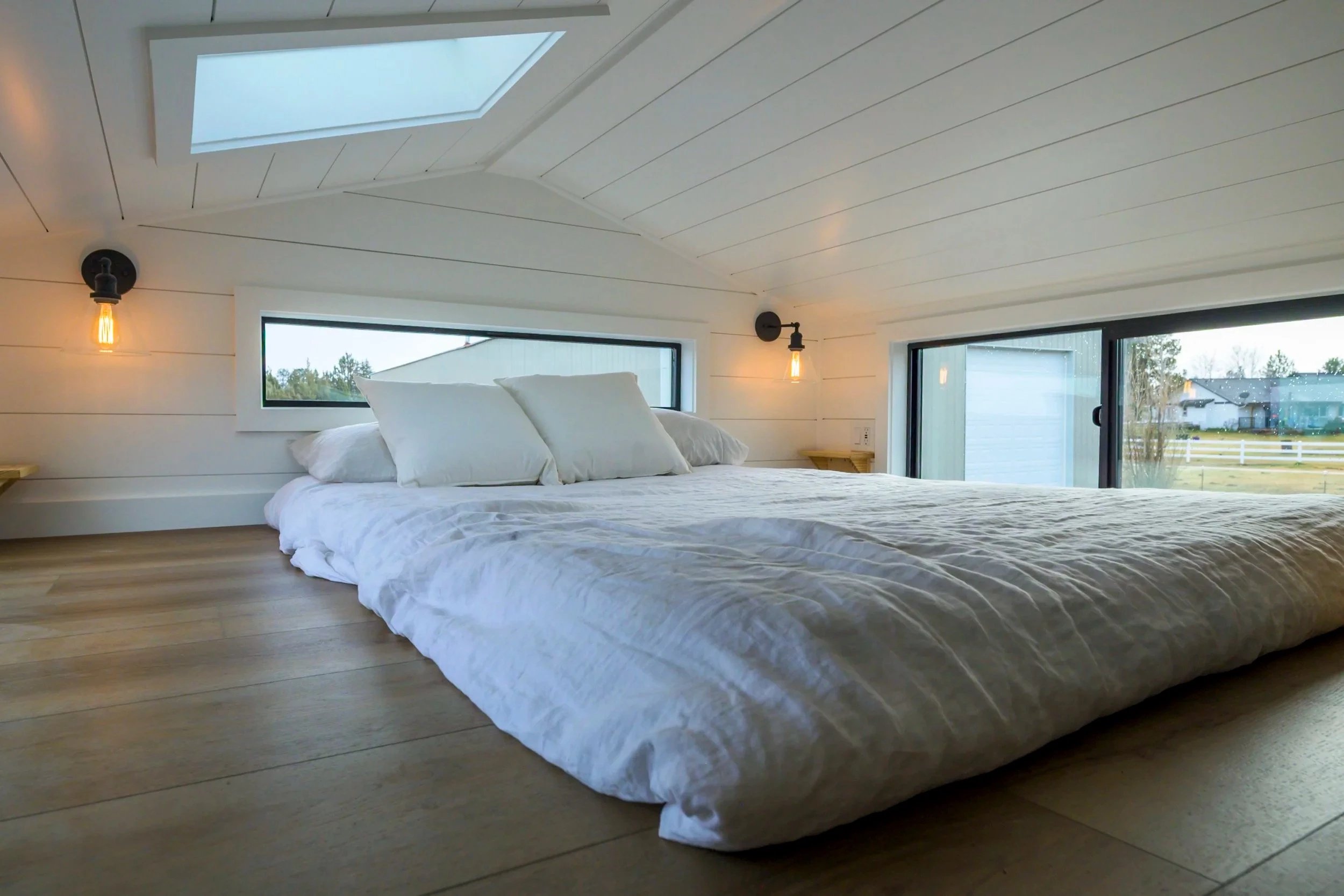 The Ochoco's loft bedroom has a low ceiling and includes a double bed