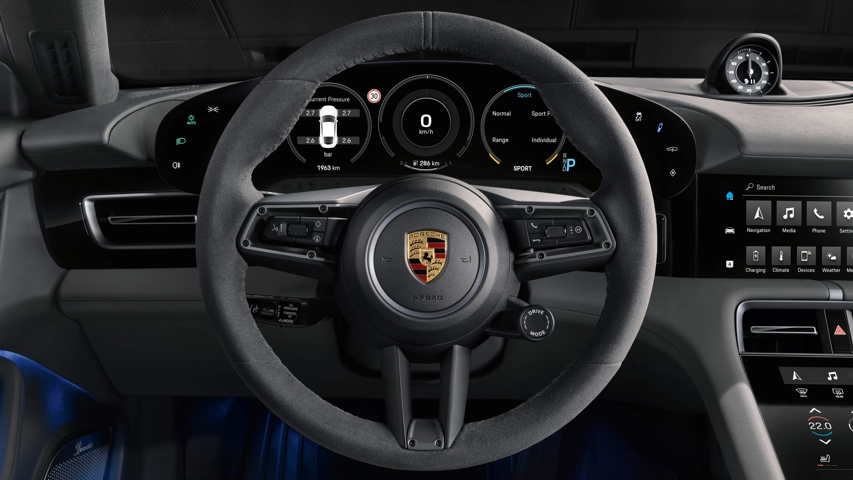Most of the Taycan's physical buttons are festooned around the steering wheel; everything else is touch screen or voice control