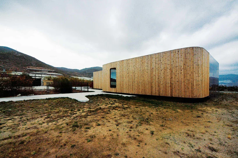 The pavilion features curved exterior walls, giving the impression that the building is smaller than what it actually is