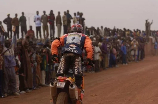 Isidre Esteve Pujol enters a town during the 13th stage of the 2005 rally. Pujol's Team Repsol-Red Bull KTM was finally fourth, just 22 seconds behind a podium. Pic - G. Soldano