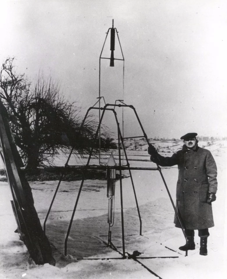 Robert Goddard with one of his experimental rockets
