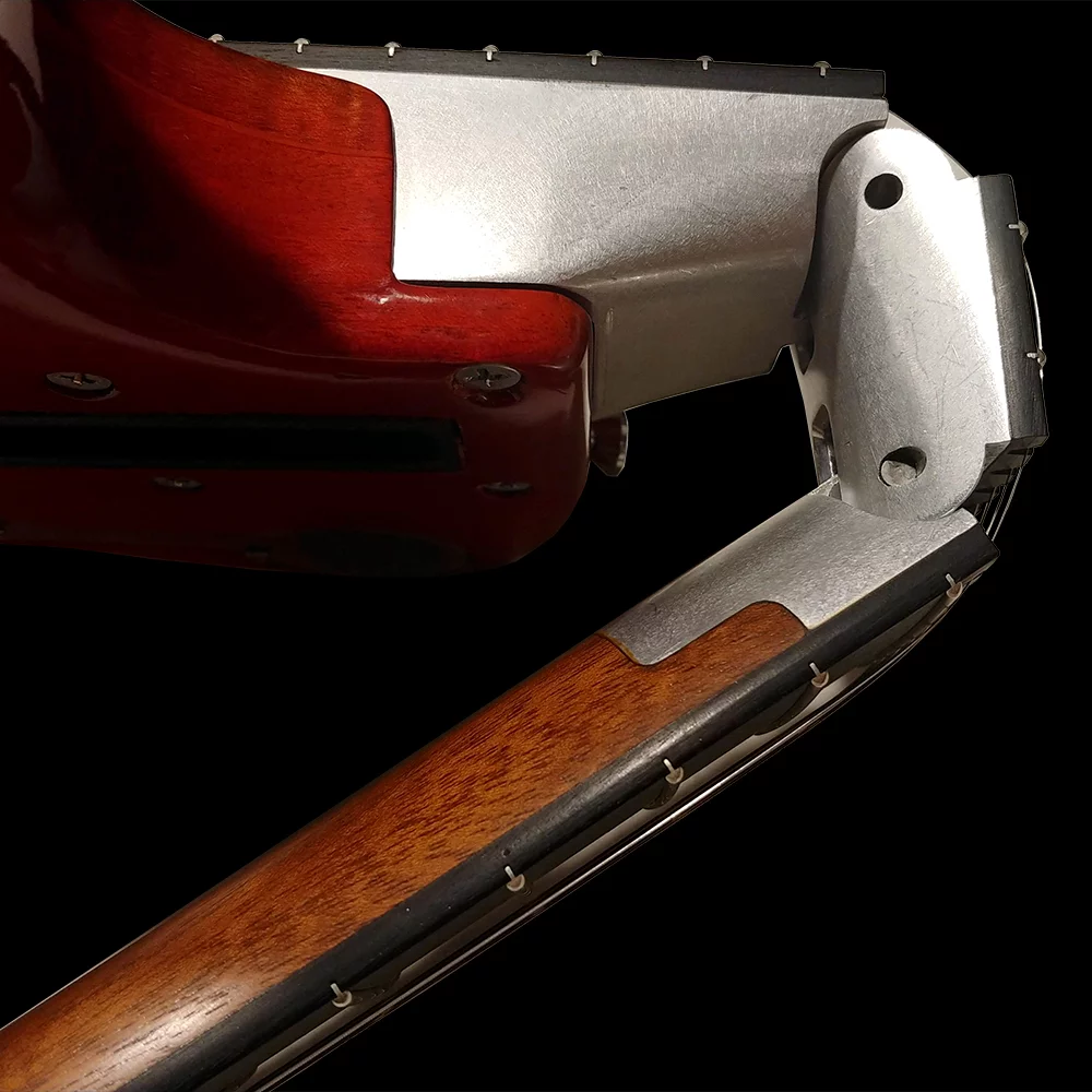 The ebony-topped neck features a two hinge setup that allows it to be folded back over the body for travel