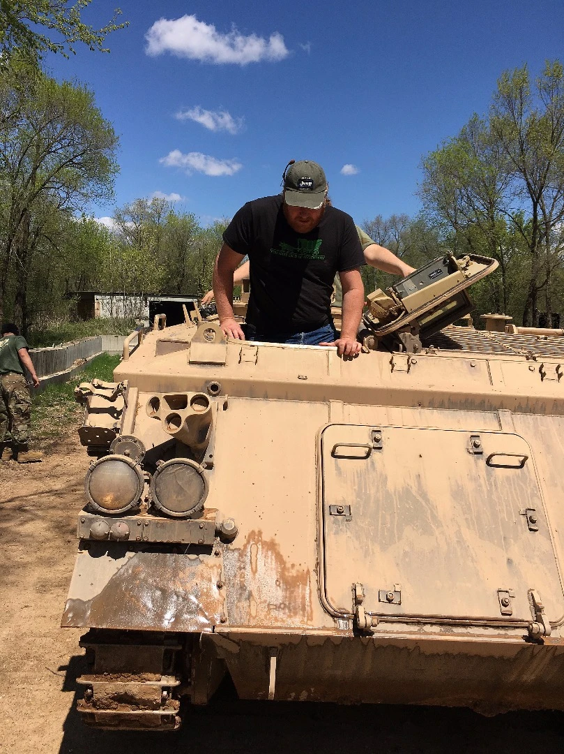 The author worms his way into the driver's pit of the APC, muttering words like "ensconced" and "made for damn Romans"