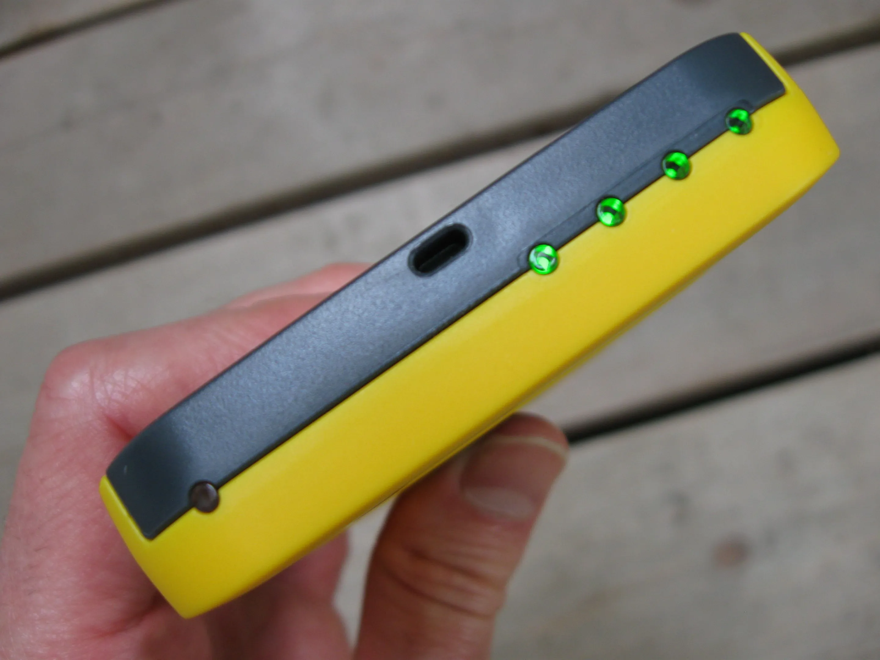 The Waka Waka Power's solar charging indicator light (left) and battery status indicator lights (right)