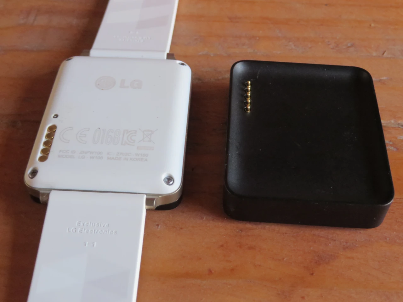 The G Watch from the back with charging station