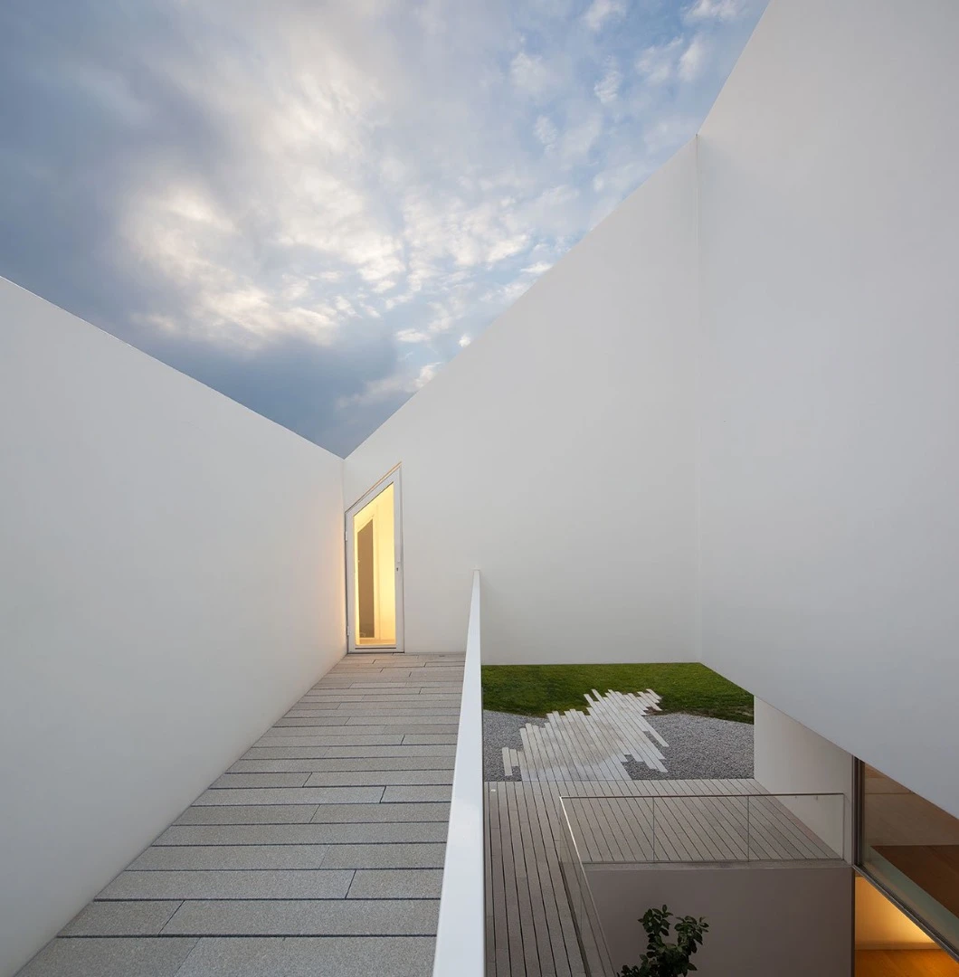 From Aires Mateus Architects this home is simple called ‘House In Leiria’. Almost all of the house is built underground with a doorless, and windowless monolithic impression of a house standing above the ground