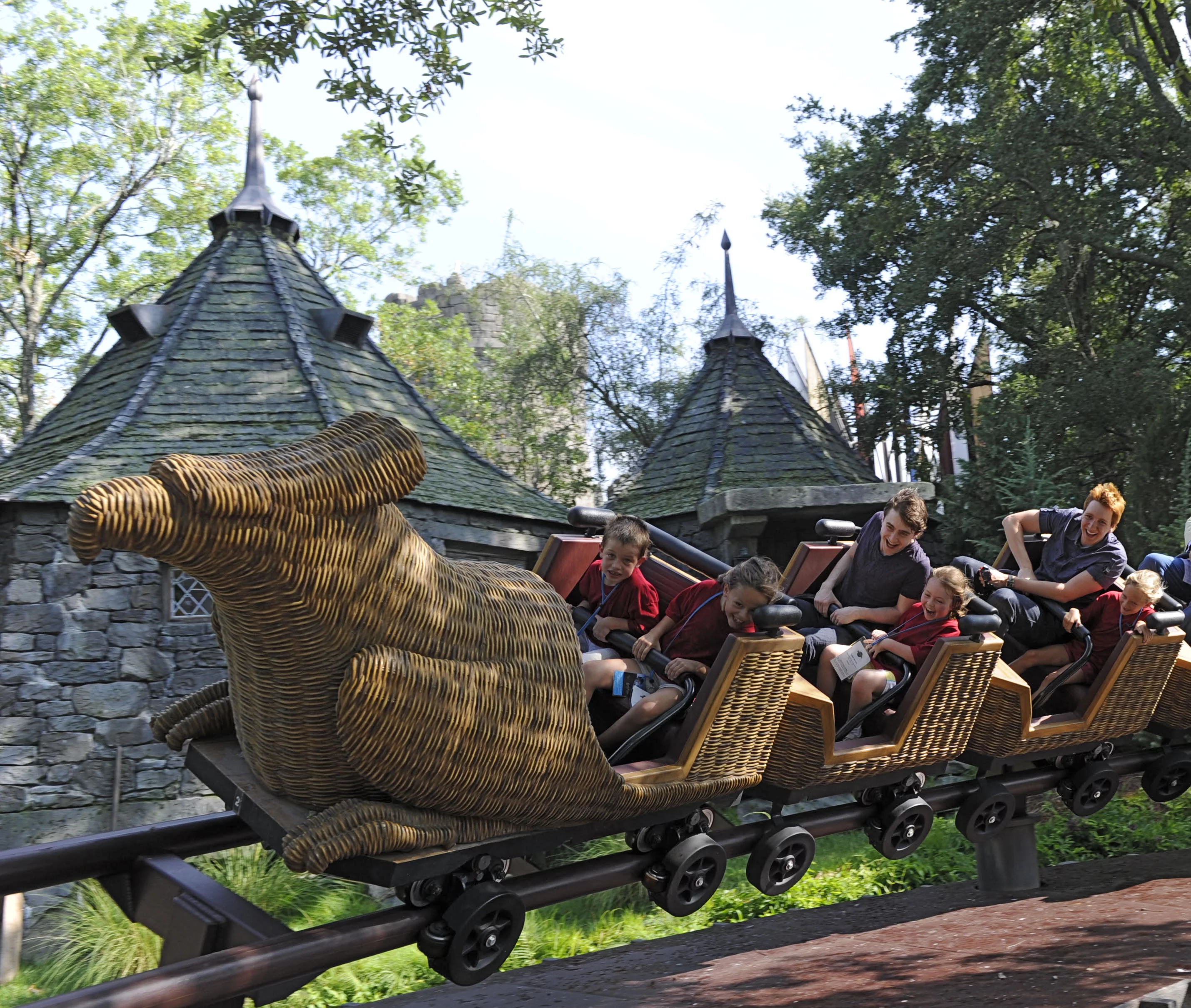 Harry Potter film stars Daniel Radcliffe and James Phelps took an inaugural ride on the Flight of the Hippogriff attraction with some of the first guests at the park