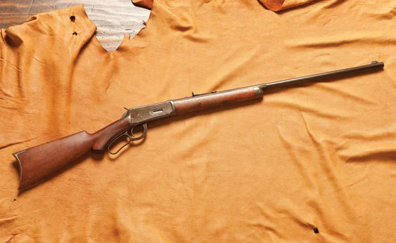 Winchester Model 1894 .30 Caliber Repeating Rifle. Features a 26 in. barrel with engraved .32 WCF markings and "smokeless powder" lettering. Metal stock butt. Deluxe features include pistol grip stock, half magazine and a combination round/octagonal barrel. Love this "Wild West" stuff. Around US$1,600-2,500