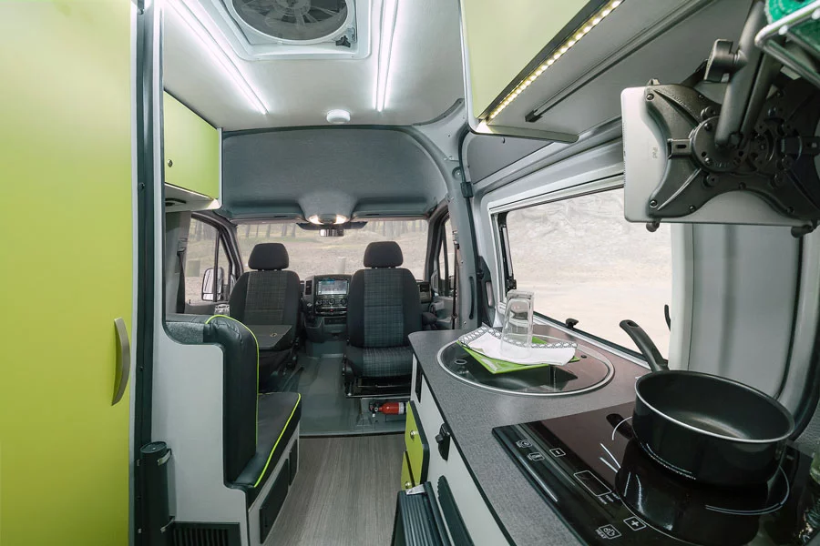 Winnebago's Revel includes a rear bedroom, central galley and wet bath, and front lounge area