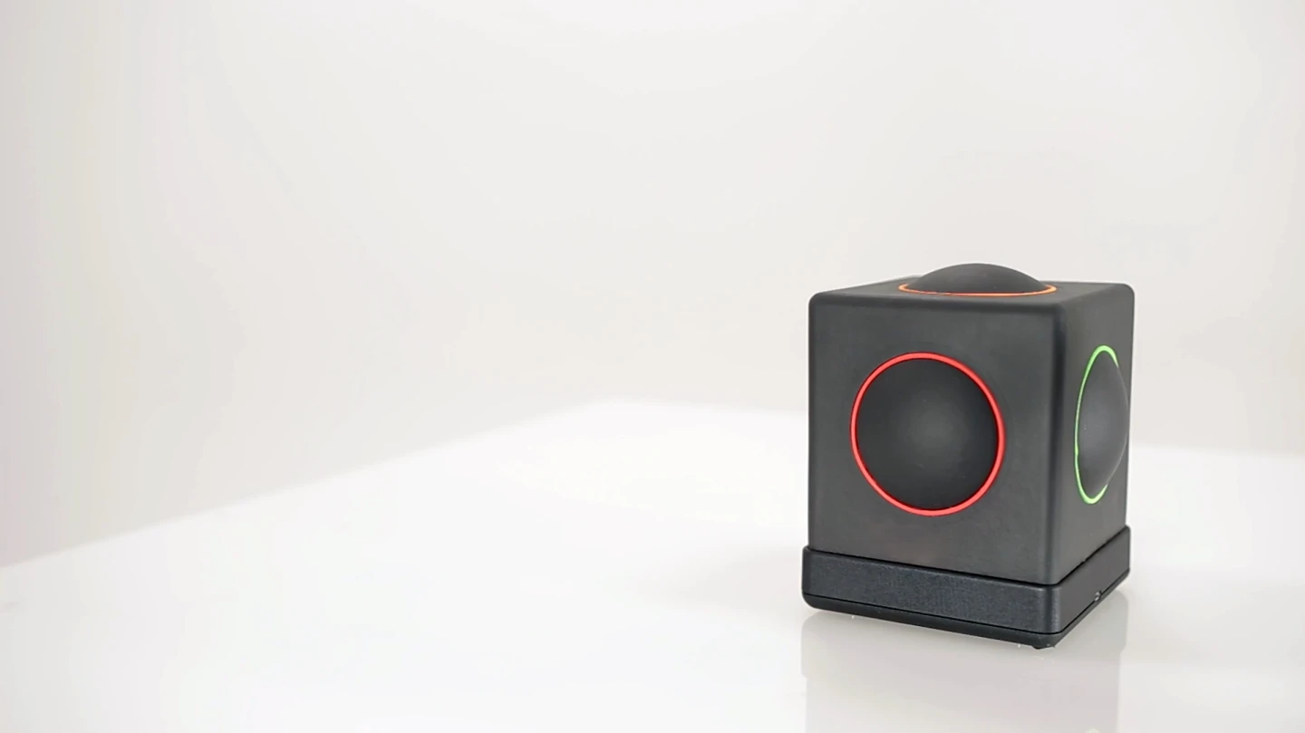 The Skoog 2.0 is a soft, squeezable, wipe-clean foam cube with spots on five of its faces
