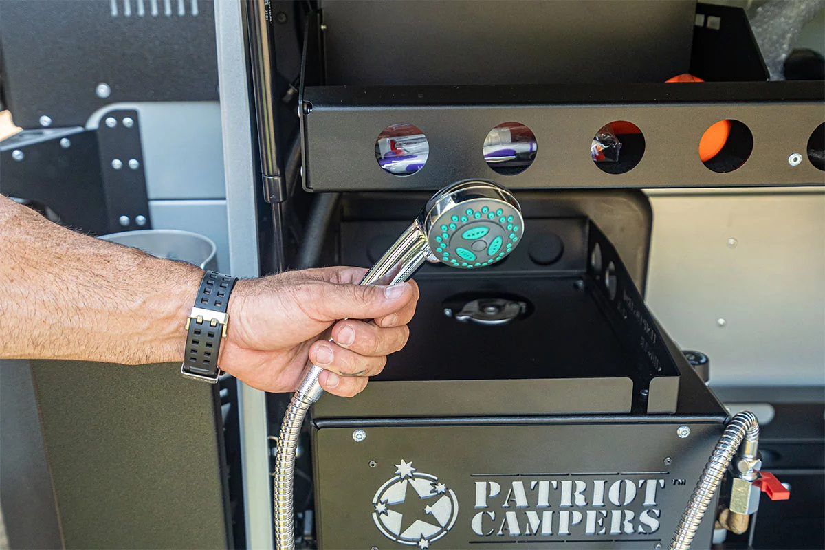 A tent/water heater and outdoor shower come standard