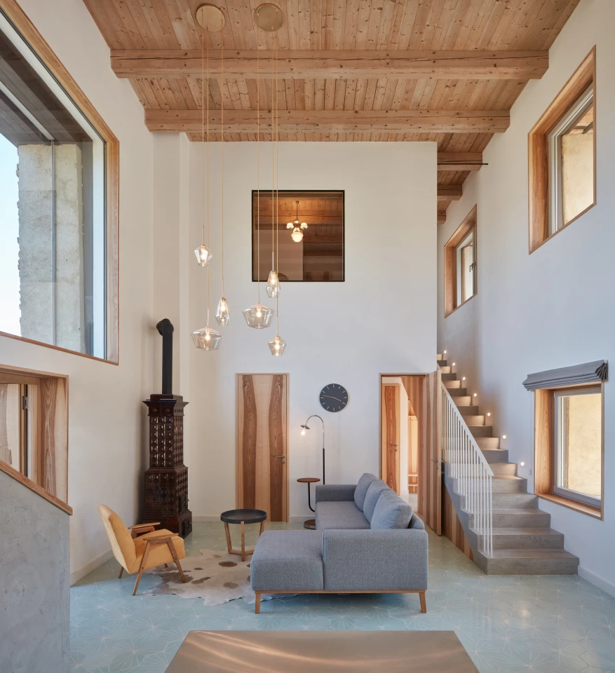 House Inside a Ruin's interior measures 248 sq m (around 2,600 sq ft) and is centered around a double-height living area