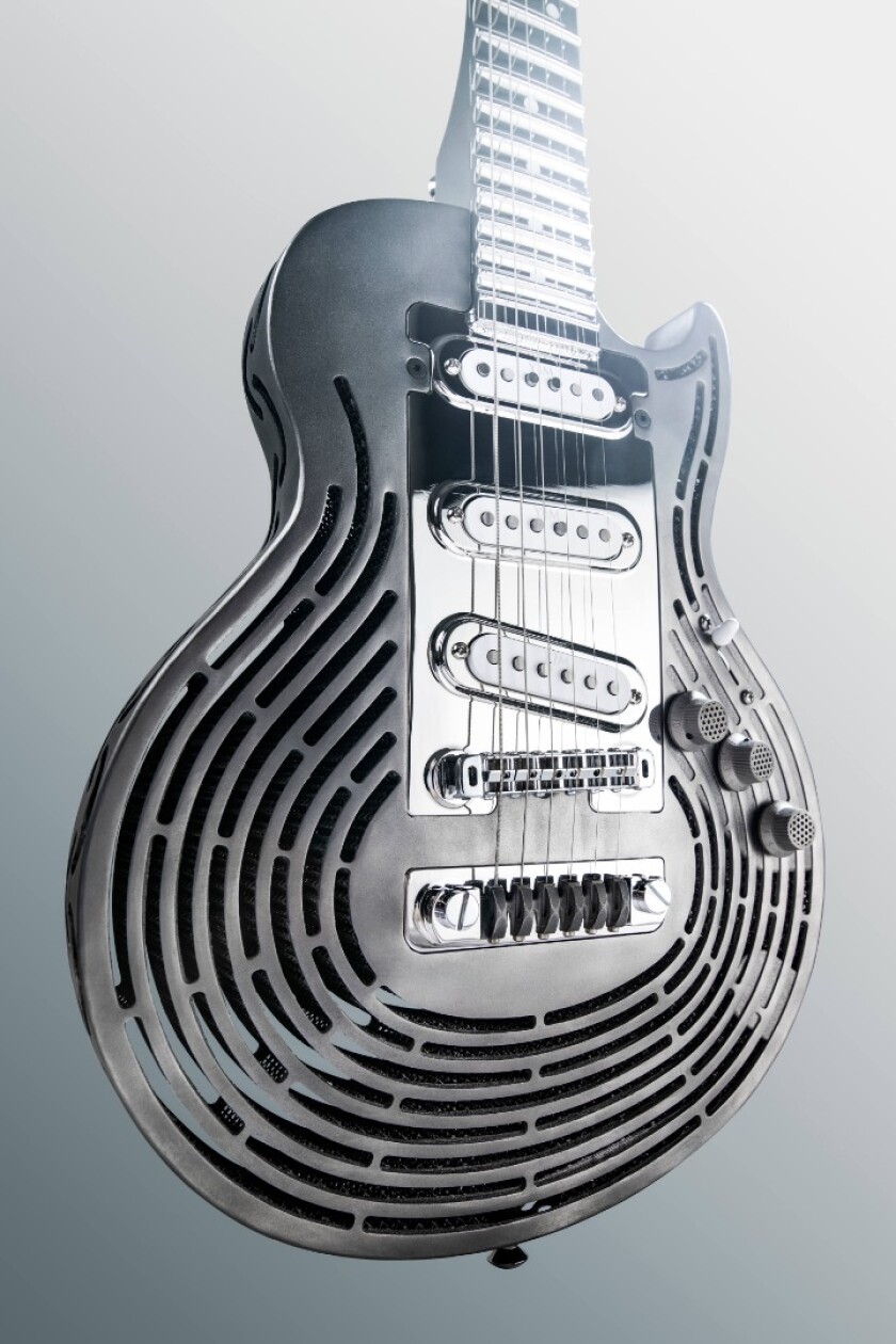 The roughly Les Paul-shaped titanium body of the Smash-Proof Guitar is 3D-printed