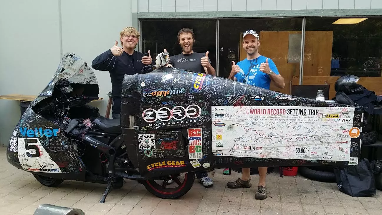 Luke Workman (centre) with "Electric" Terry Hershner (left), and the bike that Hershner rode to be the festest electric from coast to coast. It's also the bike Hershner joined the Iron Butt association on, being the first electric to pull a thousand-mile day using aerodynamic Vetter fairings. Says Workman: "This bike does more than 330 miles per charge at 70mph. I did his battery packs. The man with Terry and myself is the infamous Canadian DoctorBass from endless-sphere. He has some Guinness records for pulling a school bus with his crazy DIY Ebikes and has hacked many Zeros to be much faster than stock. He also pioneered using A123 Lithium cells for car audio SPL competitions around a decade ago, hence the bass part of his username. His real name is Stephane Melicon if I remember correctly."