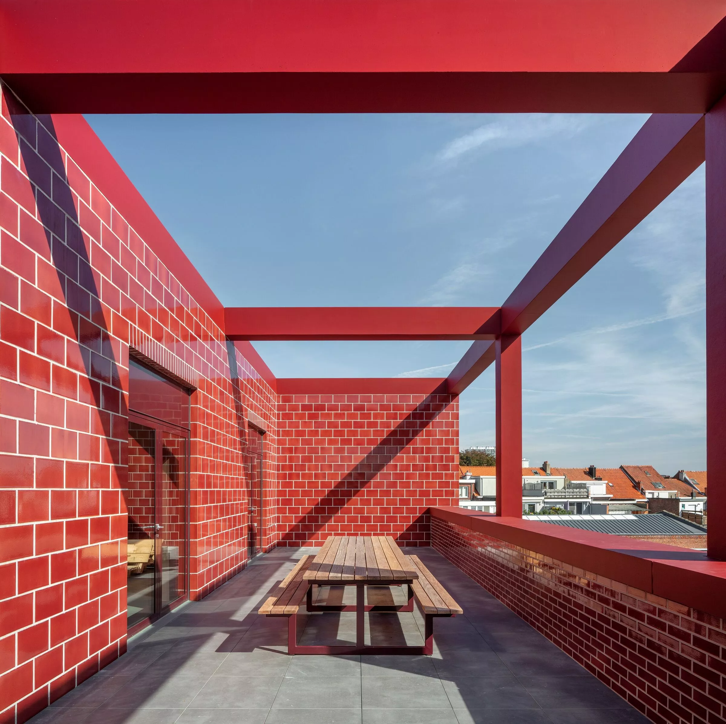 Fire Station Wilrijk's second floor includes a terrace area for the off duty firefighters