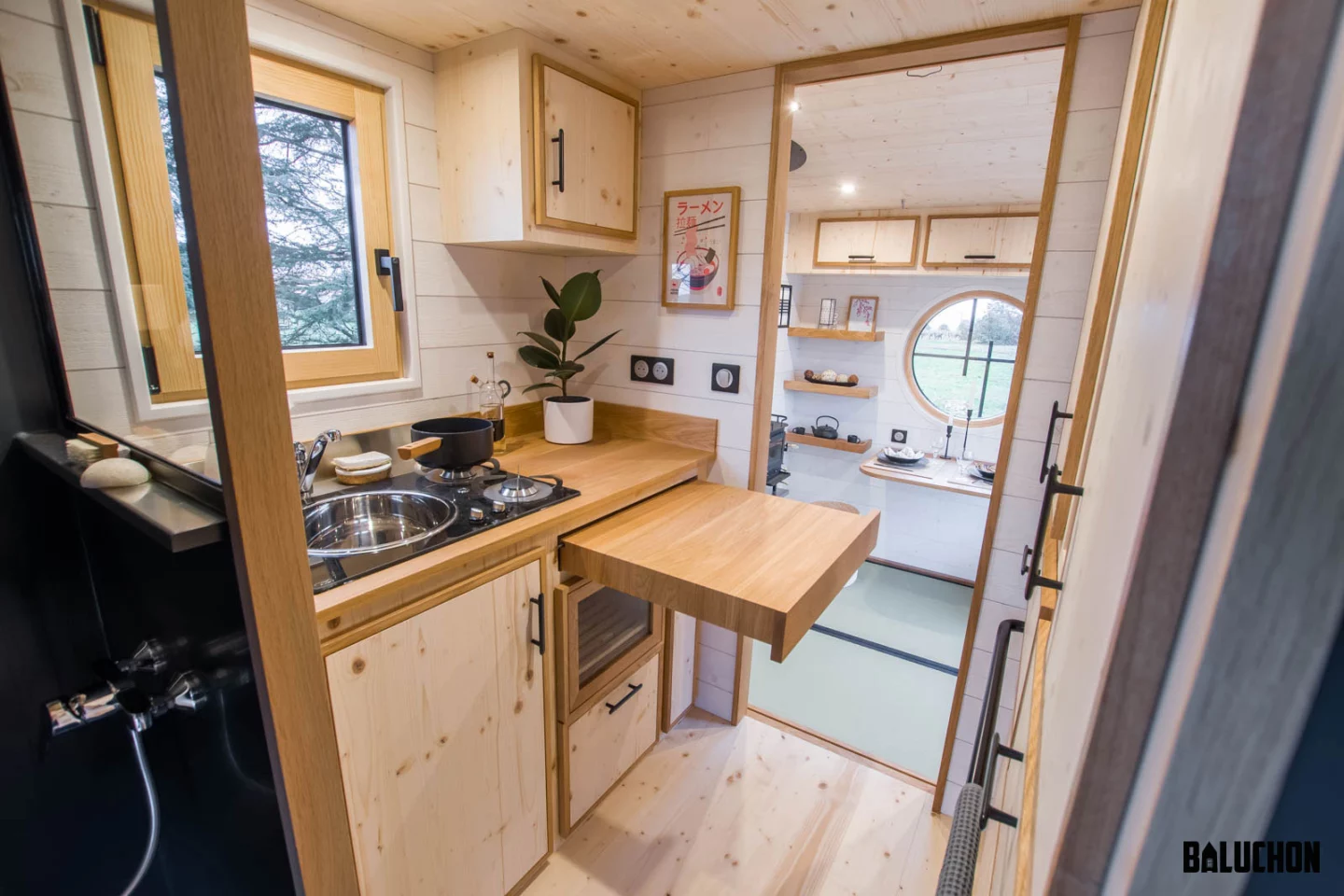 The Bonzai tiny house's kitchen includes a pull-out worktop area and quite a lot of storage space, for its size