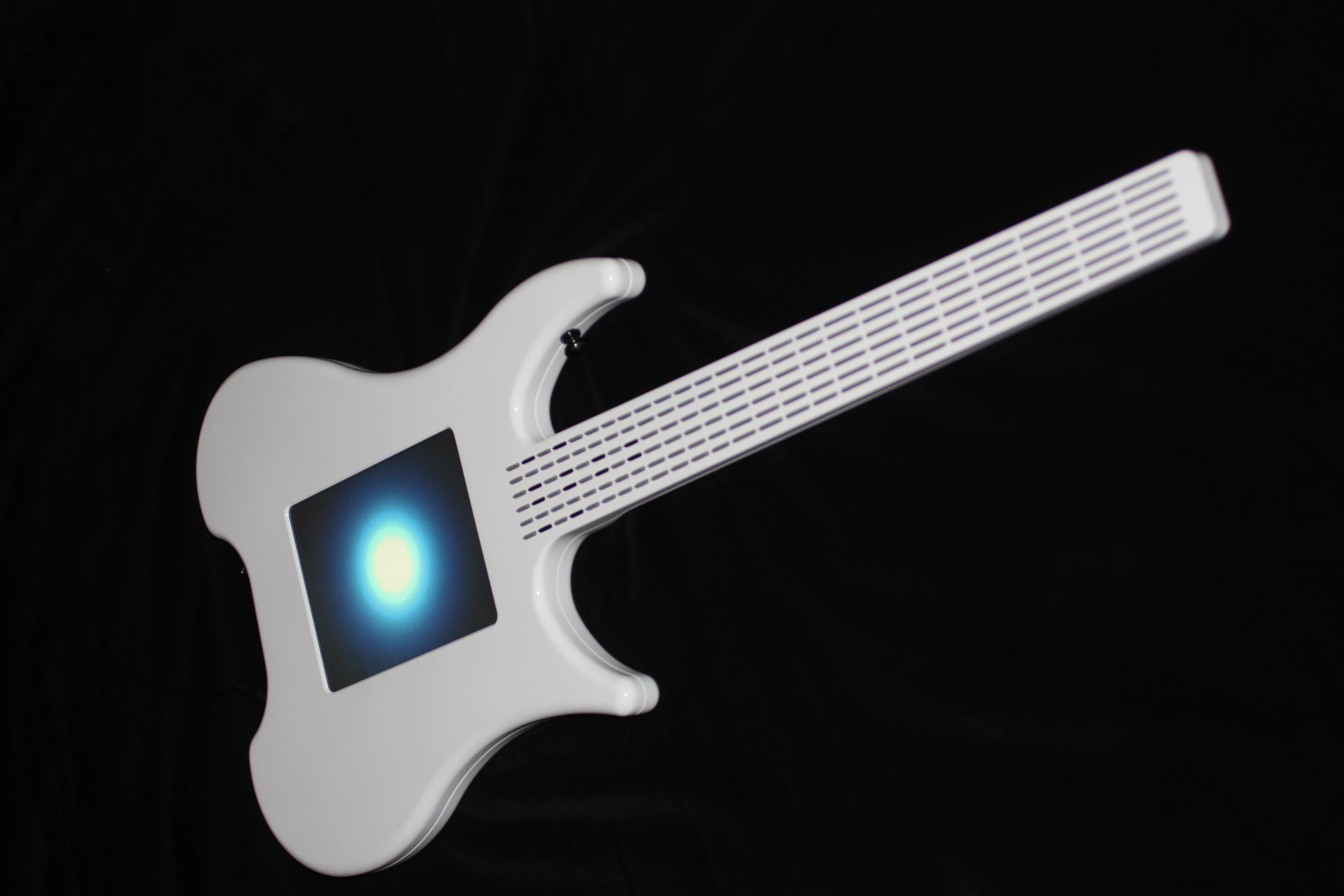 Misa has the shape of a traditional guitar but the sound is created by the interaction of hand movement or position and some open source software