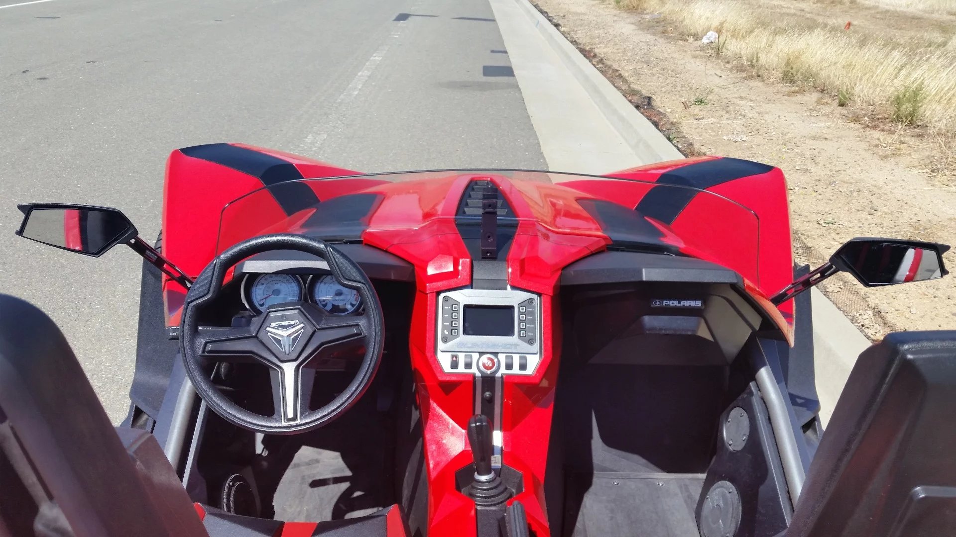 The two-person cockpit has a generous amount of leg and shoulder room, but heat from the engine bay can build up quickly on hot days