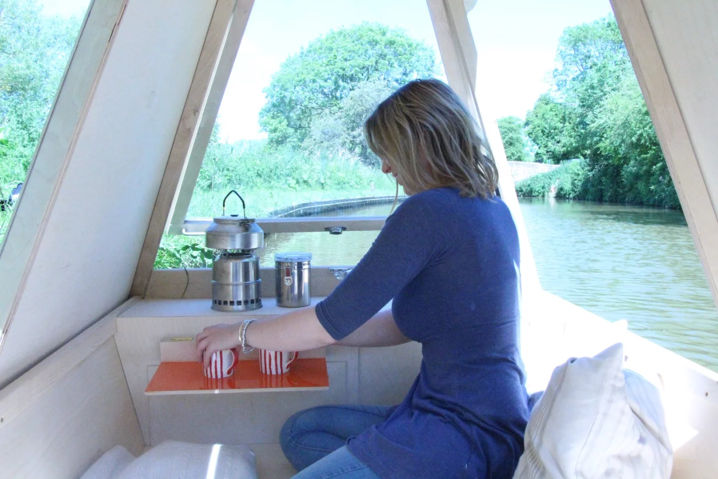 The WaterBed features a fold down side table, perfect for enjoying a cup of coffee on the canal