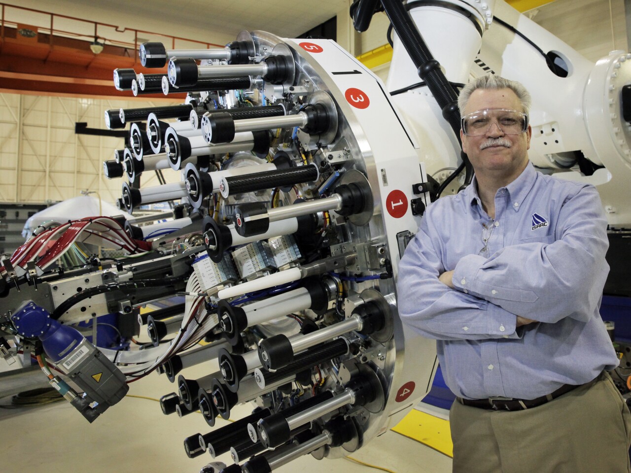 Brian Stewart, the system's integration manager, poses with ISAAC (Photo: NASA/David C. Bowman)