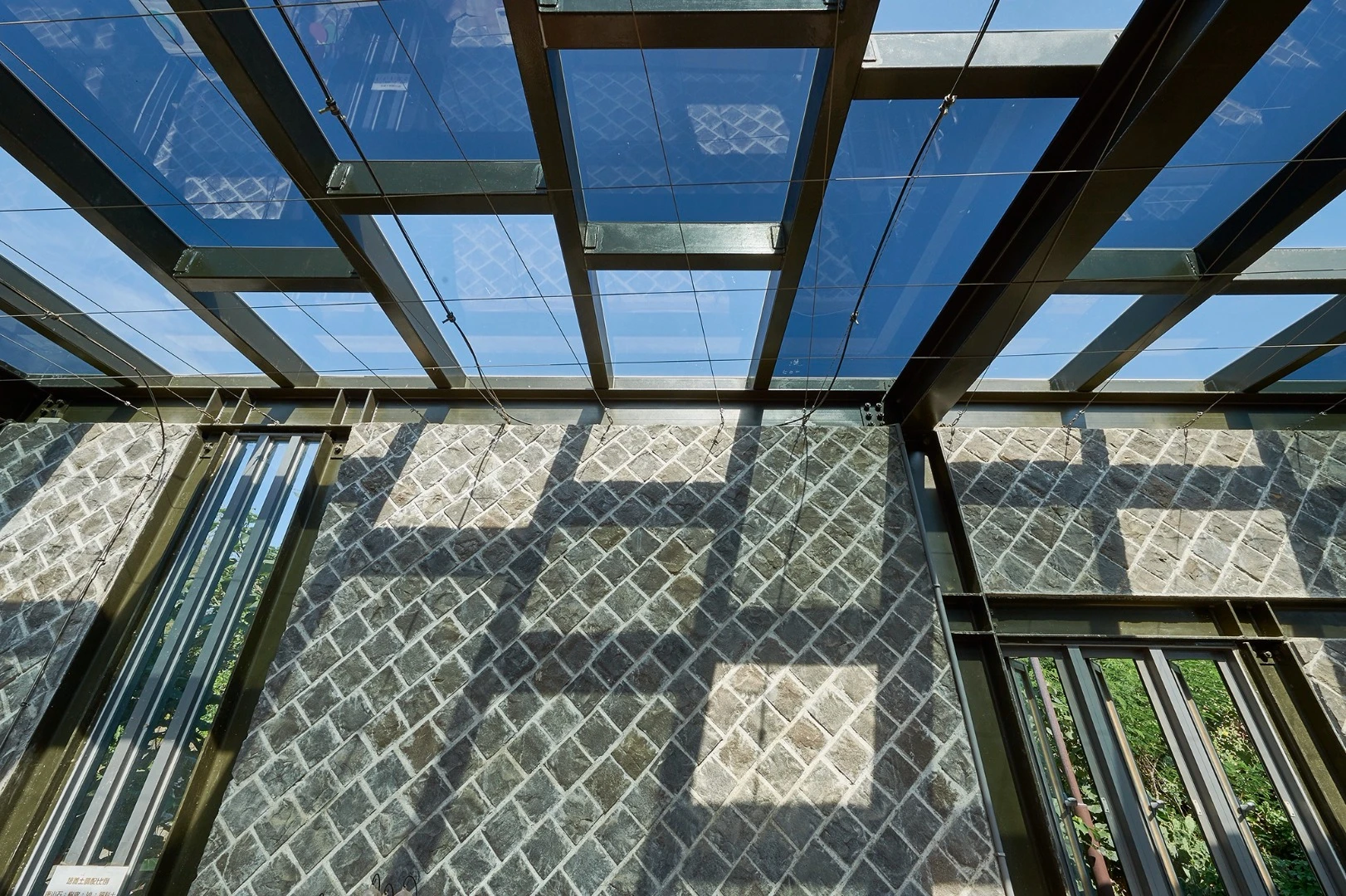 Interior of the big cactus greenhouse at the Penghu Qingwan Cactus Park, showing the well-ventilated walls and light-permitting roof