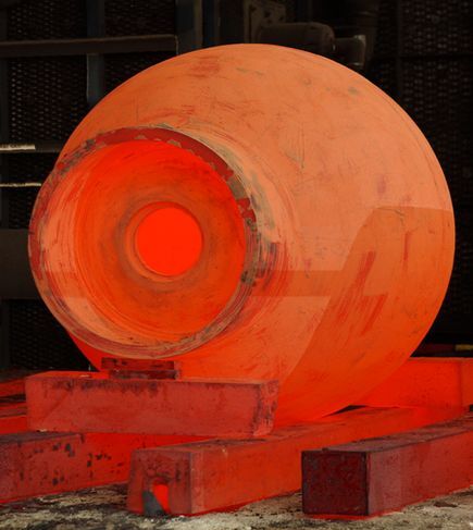 The DEEPSEA CHALLENGER's steel pilot sphere glows red hot from the manufacturing process(Photo: DEEPSEA CHALLENGE/National Geographic)