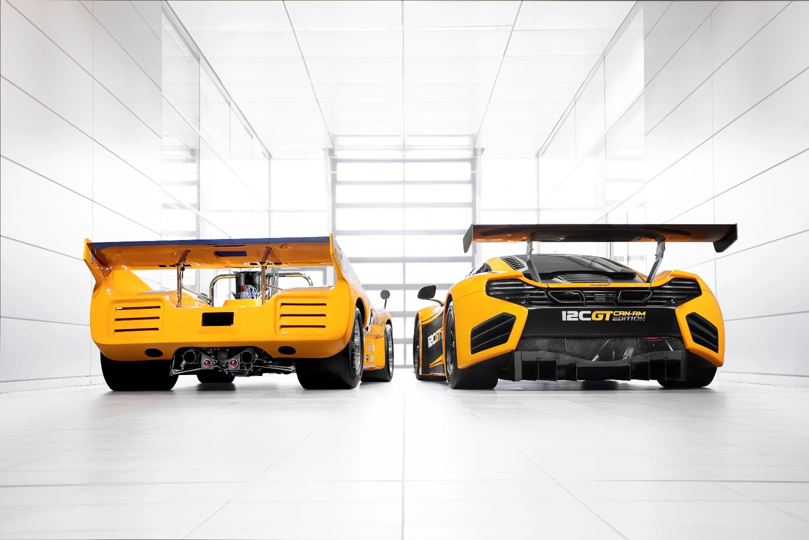 The McLaren MP4-12C alongside a 1970 Can-Am racer