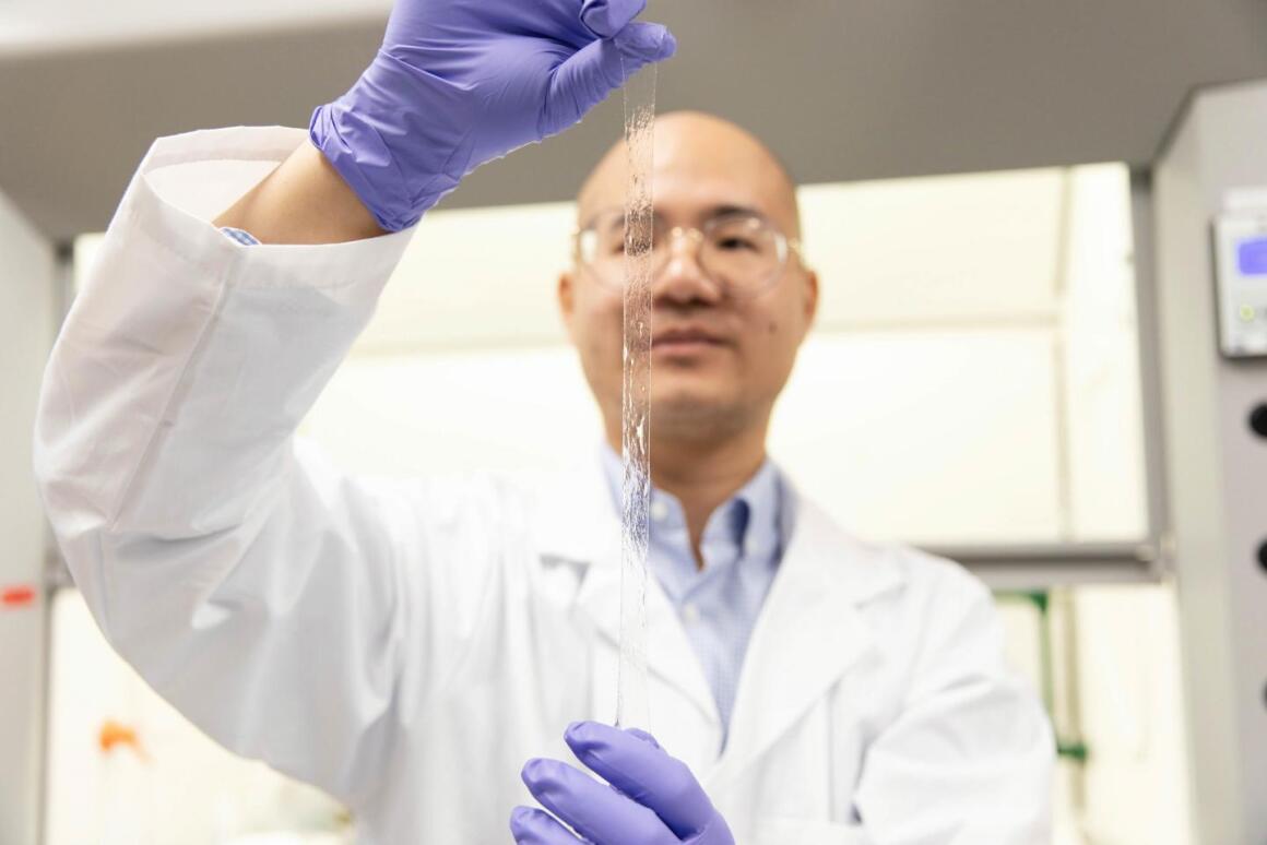 Researcher Binbin Ying stretches a piece of the AISkin