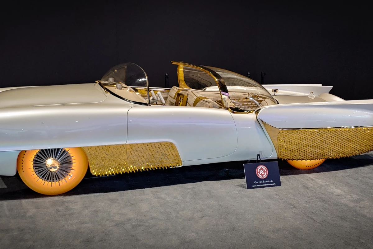 Sometimes oddballs hit you in the face so hard, you kind of fall for them. This Golden Sahara concept has $30,000, color-changing, illuminated tires and a cocktail lounge in the back seat