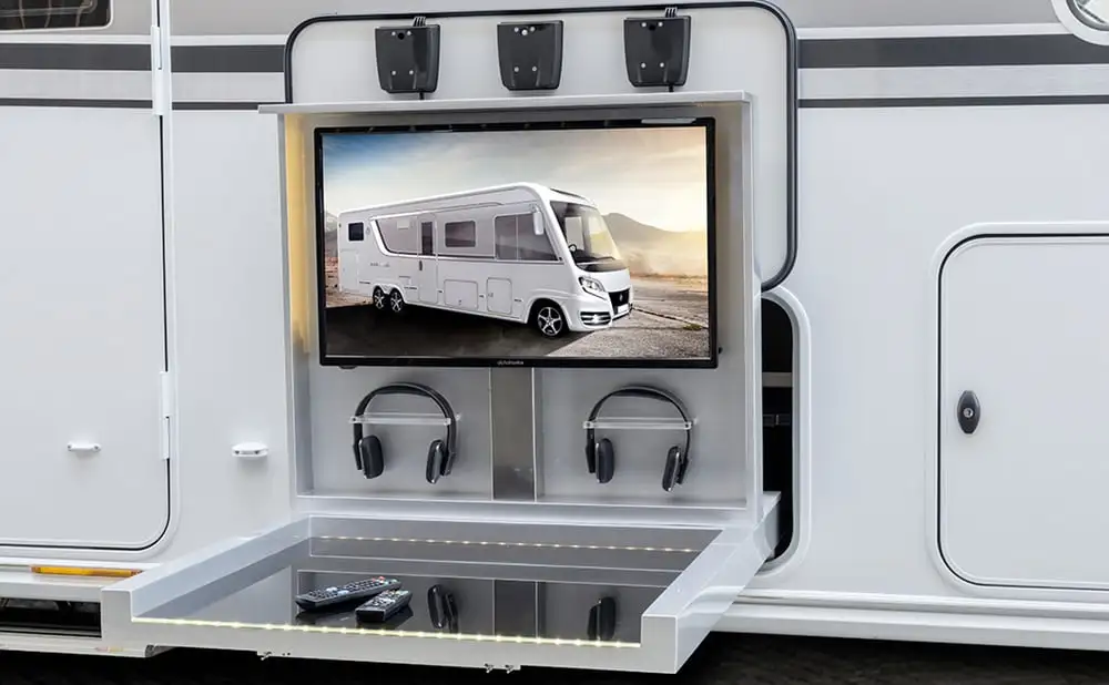 The Knaus Sun I has an outdoor entertainment system with TV and Bluetooth headphones