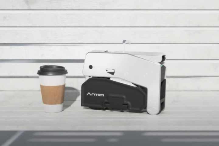 The folded Arma is larger and heavier than a cup of coffee but still easy to grab and go