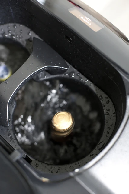 A wine bottle being spun in the V-Tex