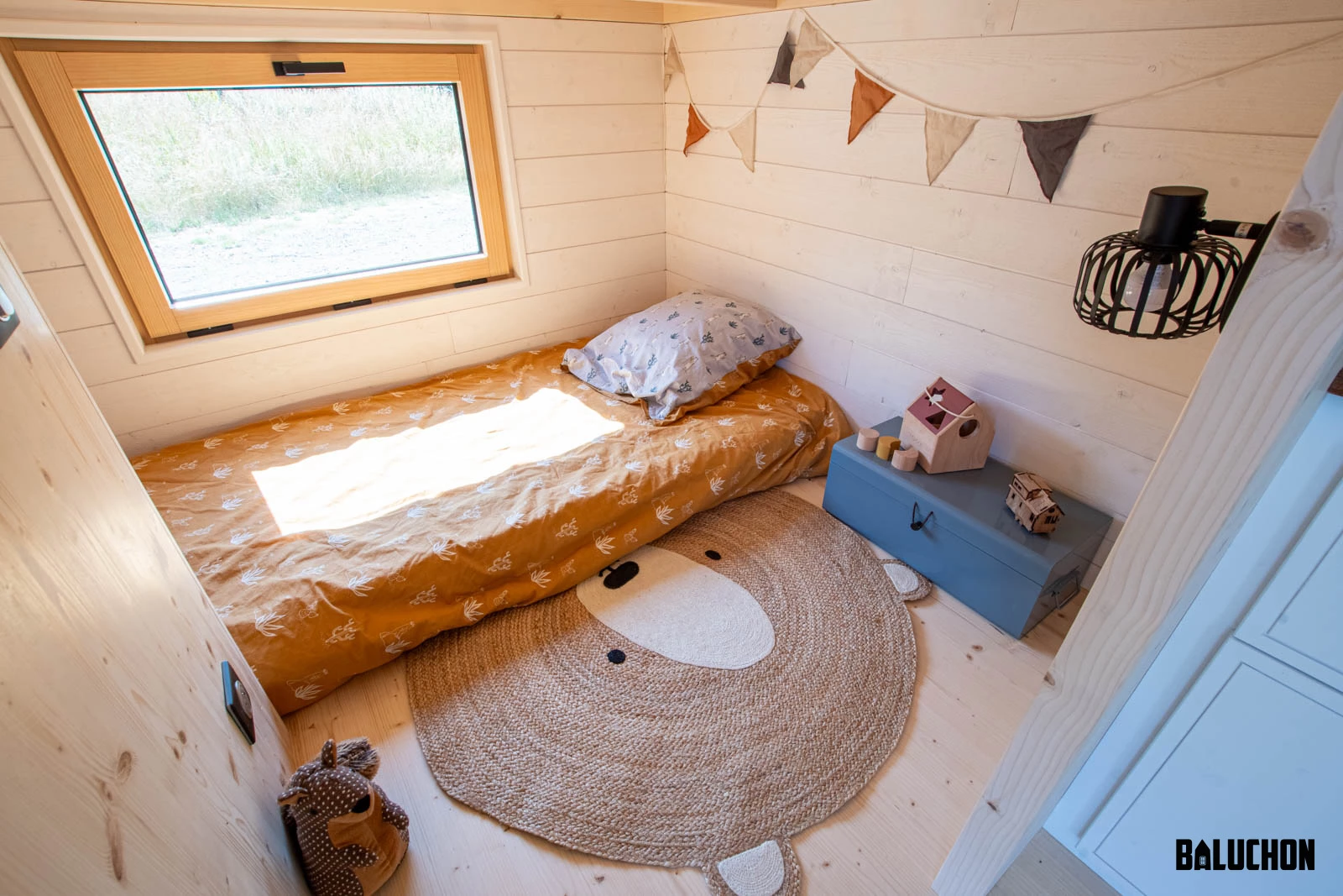 The Nouvelle Dans' downstairs bedroom looks very snug and includes a bed and a little storage space