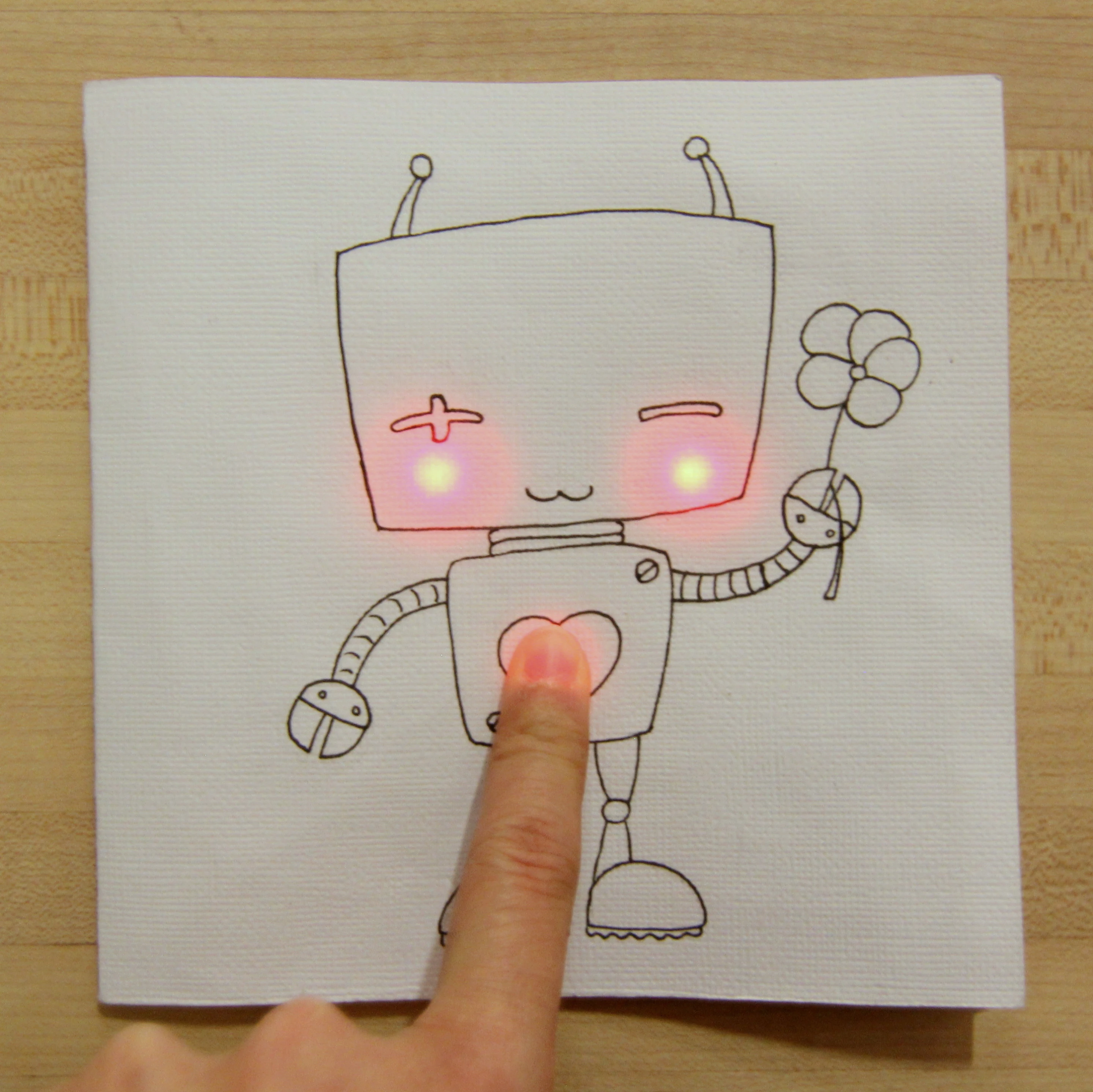 Chibitronic stickets lets you add circuitry to art projects creating an interactive greeting card that lights up