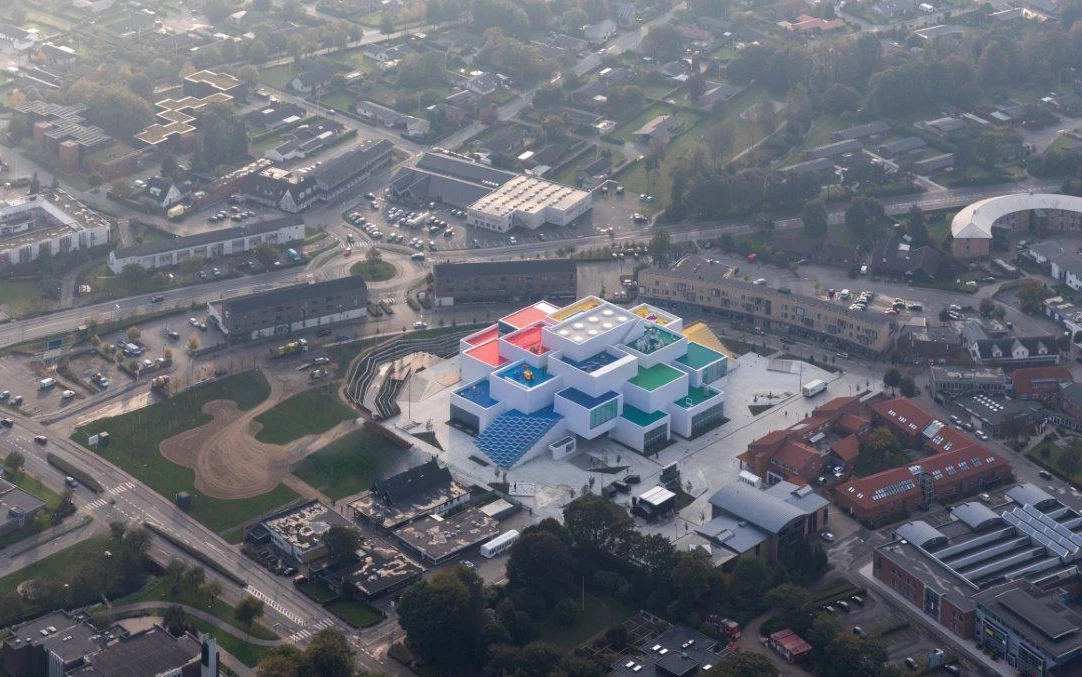 The Lego House appears to be constructed from oversized Lego bricks
